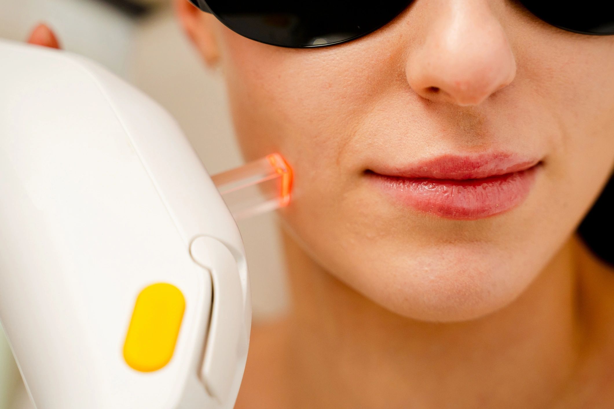 Luxury laser treatment in soft-focus clinic lighting