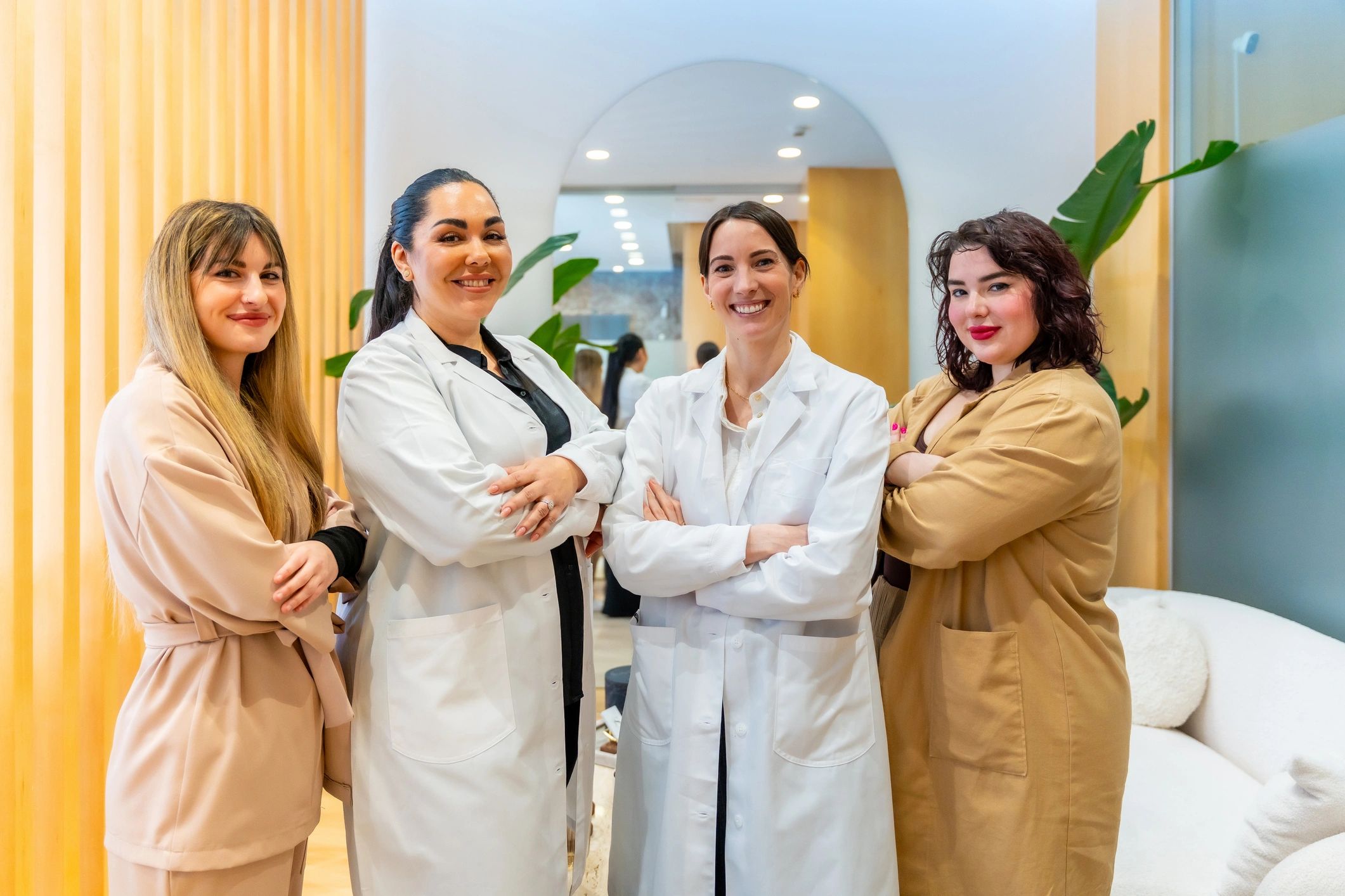 Beauty clinic team standing together in a modern clinic